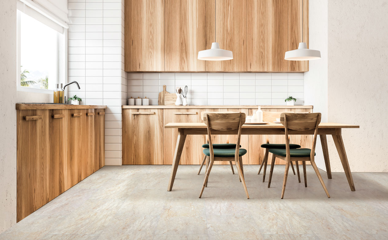 stone look luxury vinyl tile flooring in kitchen with wood cabinetry and wood dining table with matching chairs